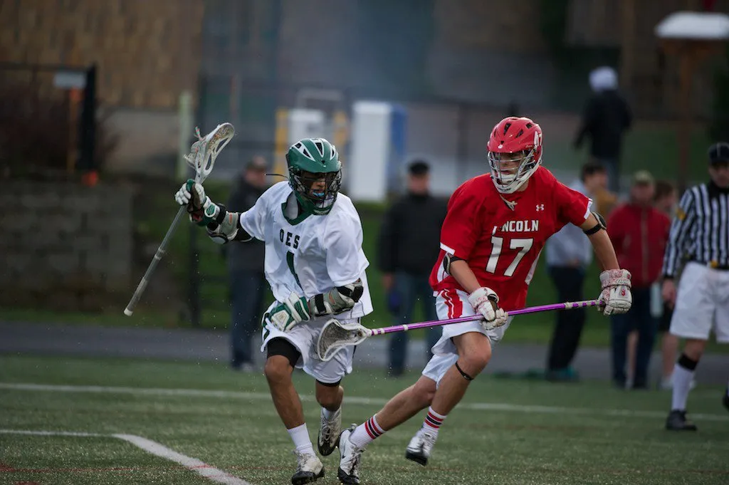 2 lacrosse players during a game