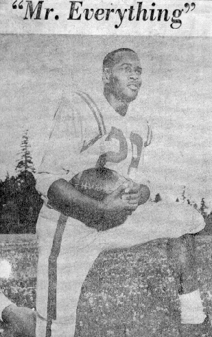 Black and white photo of a football player in uniform kneeling on one knee holding a football, titled 'Mr. Everything'.