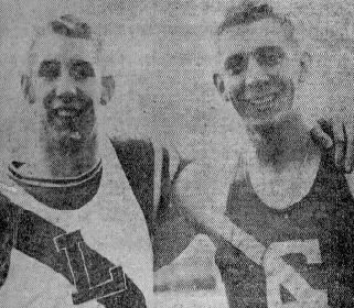 Two male athletes wearing vintage track uniforms smiling side by side, with one resting his arm on the other's shoulder.
