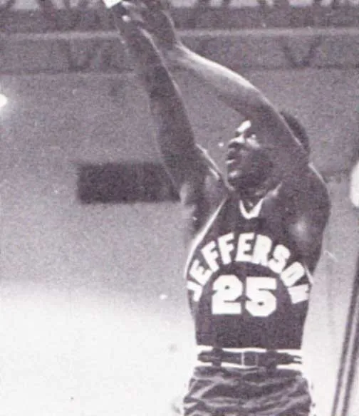 Black and white photo of a basketball player in a Jefferson jersey with number 25 shooting a basketball.