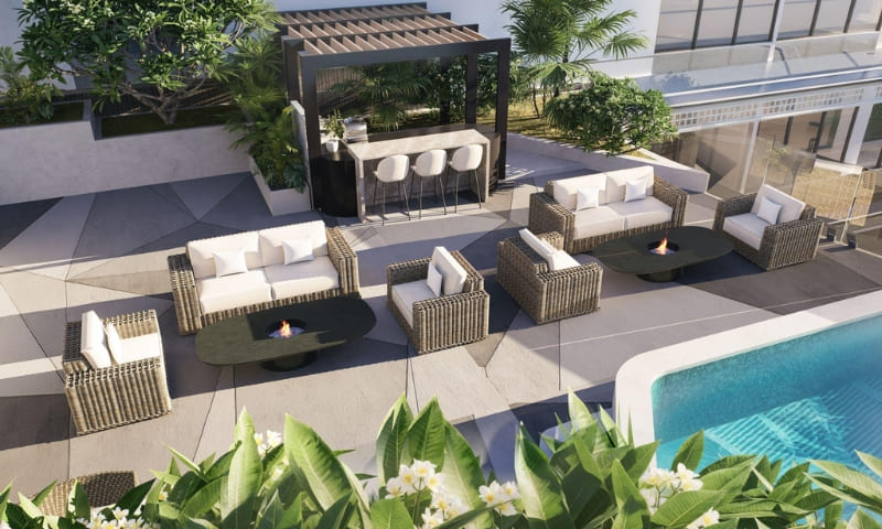 Rooftop infinity pool and wellness deck in luxury Arjan Dubai apartment building at sunset