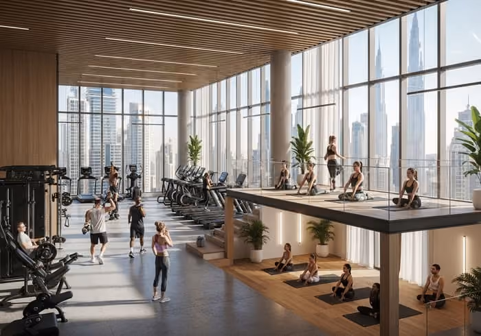 Modern gym and yoga studio in Dubai with people exercising in a bright, spacious environment