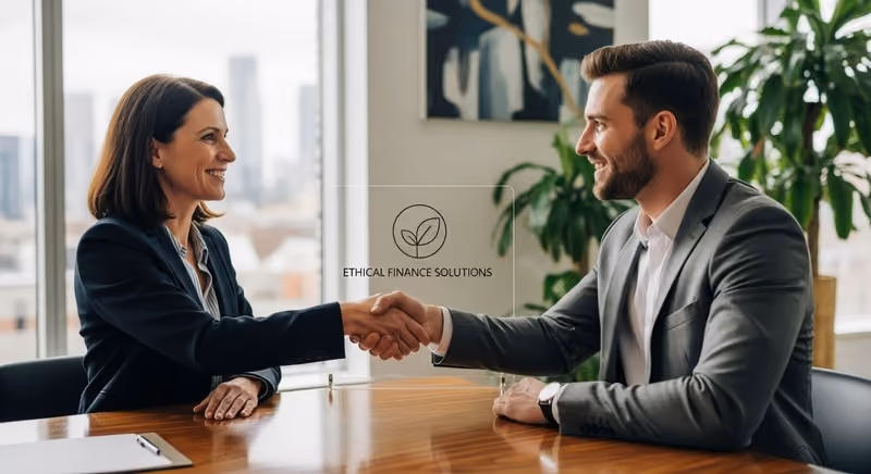 Business owner and bank advisor handshake in modern office, signifying partnership