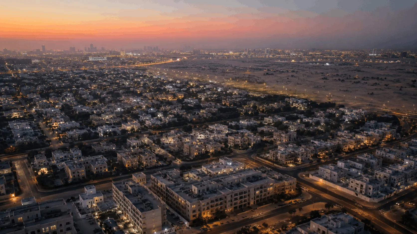 Aerial view at dusk over eastern Dubai residential communities near the future Blue Line corridor