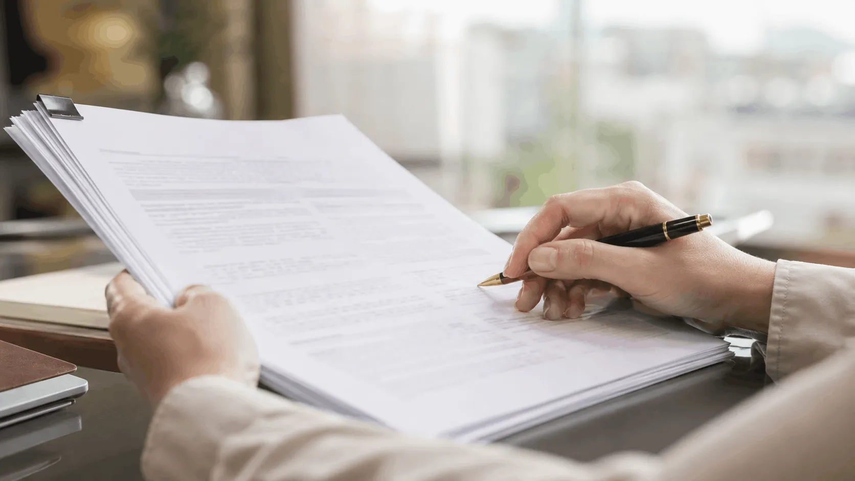 Buyer reviewing an off-plan Sale and Purchase Agreement before signing