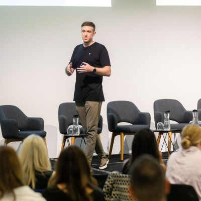 Ben Satchwell speaking on stage