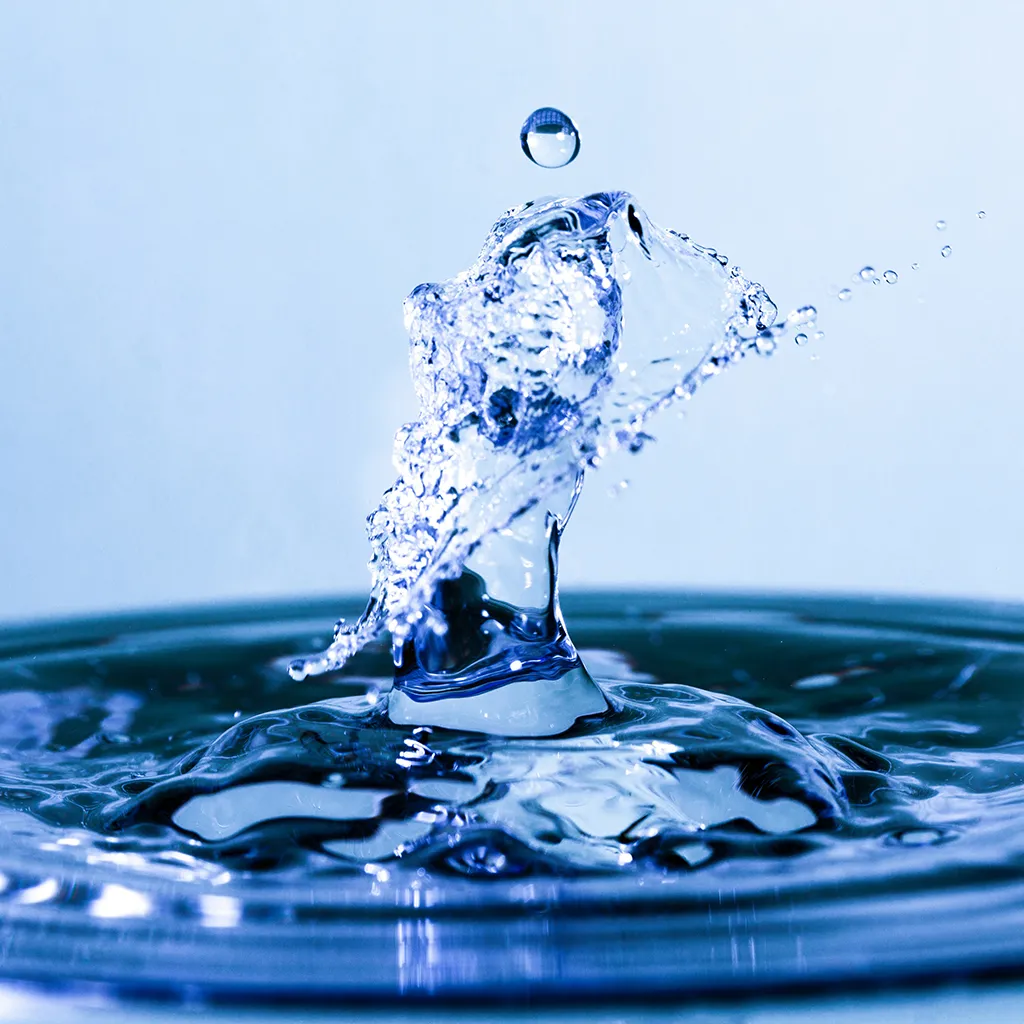 Clear water droplet representing GFS Solutions' magnetic water conditioners for improving water quality and reducing scale buildup in farming systems