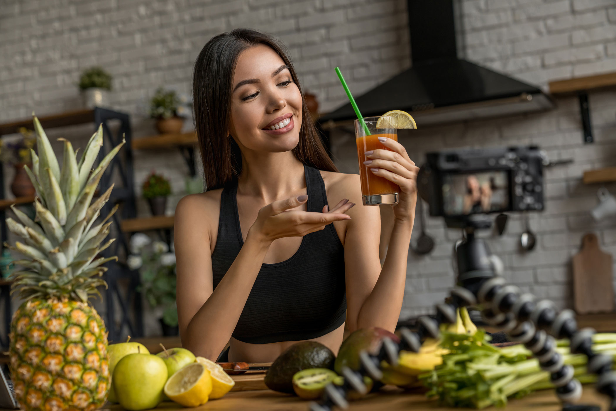 Image of Social Media Influencer Showing a Fruit Smoothie Cocktail in a Glass