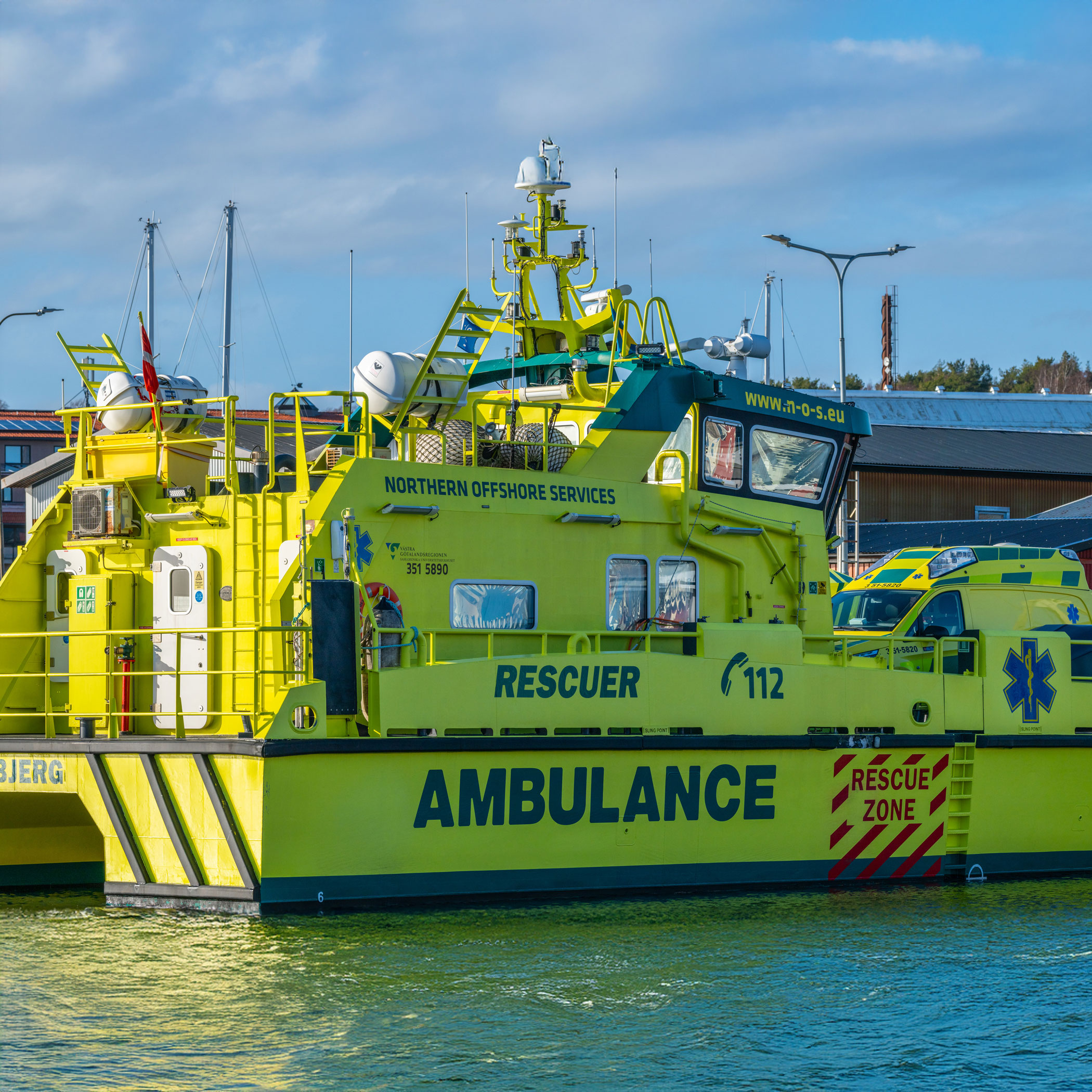 An Ambulance rescue boat at a dock at a harbour