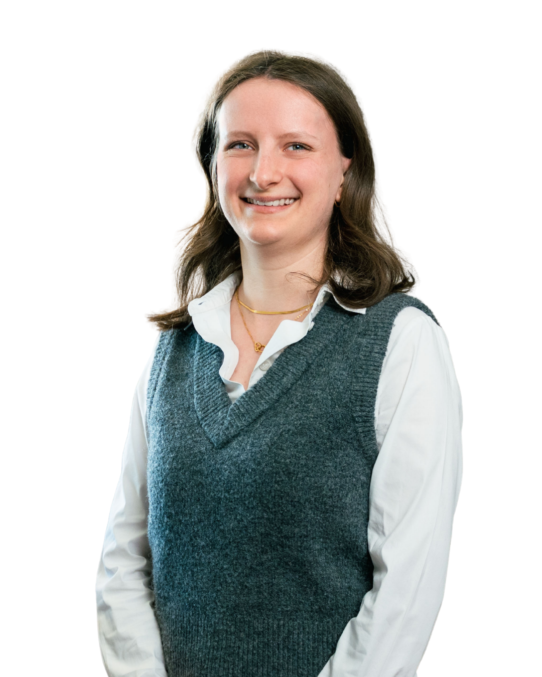 Smiling woman with long brown hair wearing a white shirt and gray knit vest, facing forward.