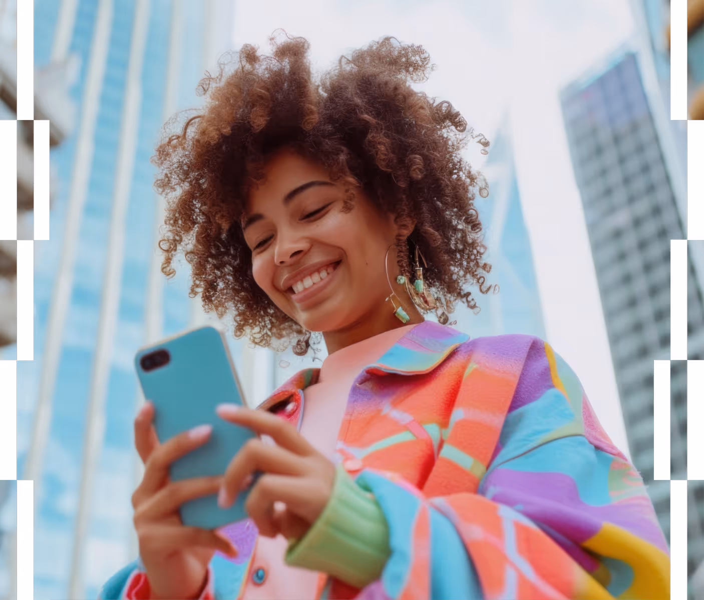 Smiling woman with curly hair wearing a colorful jacket looking at her loyalty programme.