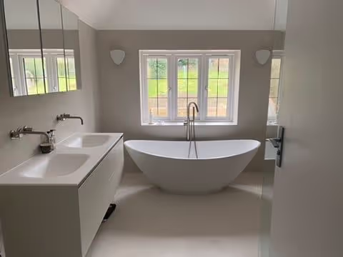 Professional bathroom fitting in a new-build Surrey property with a contemporary look.