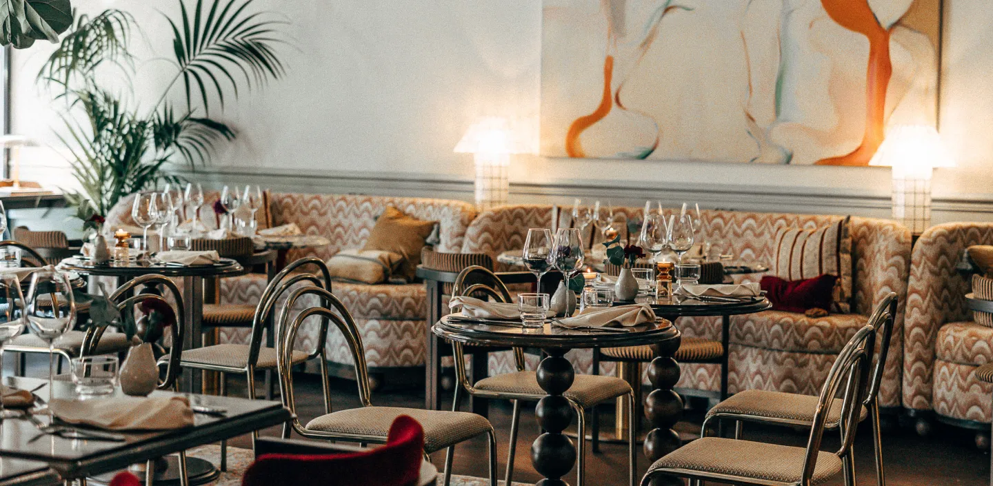 Rue Madame restaurant main room with set tables