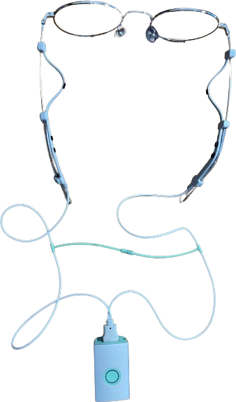 The Cephalgo EEG adapter fitted to a pair of eyeglasses, with its electronics unit on the cord