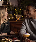 Couple dining in christmas setting with lights, captured at Neighbourhood — a refined christmas restaurant kildare experience in County Kildare.