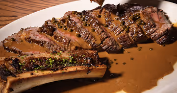 Plated steak dish served with festive sauce, captured at Neighbourhood — a refined christmas restaurant kildare experience in County Kildare.