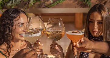 Group toasting with prosecco at christmas brunch, captured at Neighbourhood — a refined christmas restaurant kildare experience in County Kildare.