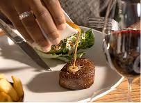 Guest pouring peppercorn sauce steak Neighbourhood restaurant Naas