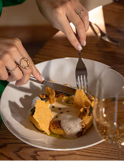 Chef delicately plates a seasonal course within Neighbourhood’s award-winning fine dining setting in Naas.