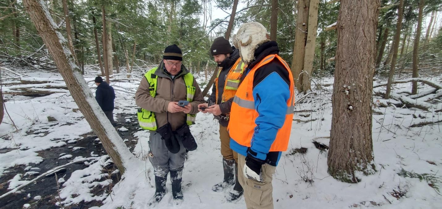 A group of men in the snowDescription automatically generated