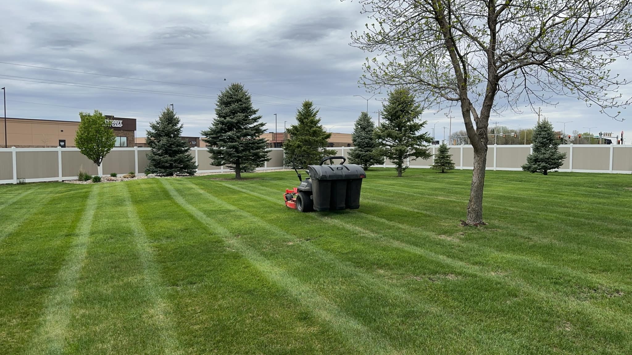 Photo of Property Care Pros maintaining a residential lawn