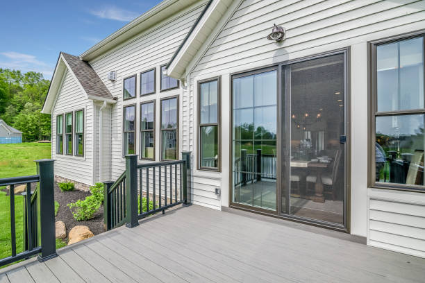 Completed sliding patio screen door installed on a backyard patio entrance