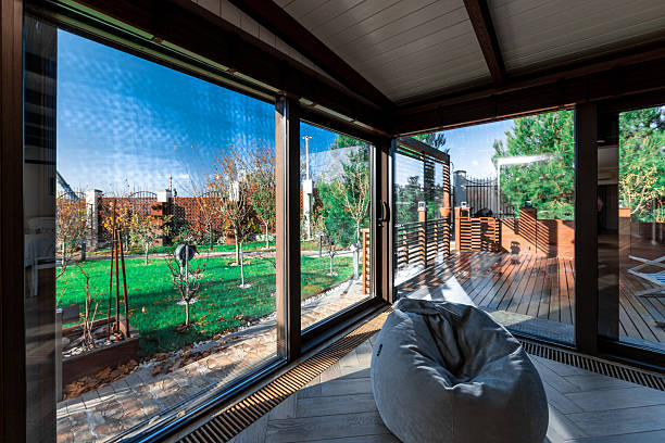 Outdoor patio scene with mesh screens installed to keep flies away from patio spaces