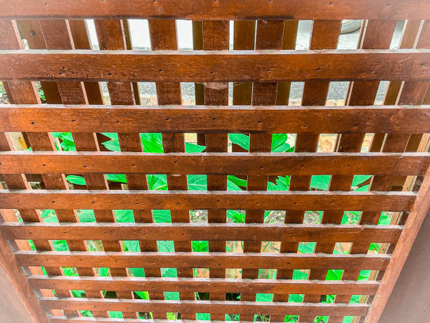 Wooden lattice panels used as a creative patio enclosure to add privacy and style
