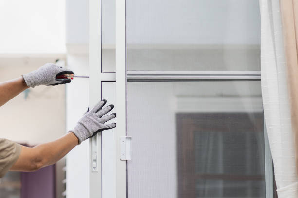 Close-up of retractable patio screens being installed for budget-friendly patio enclosure ideas