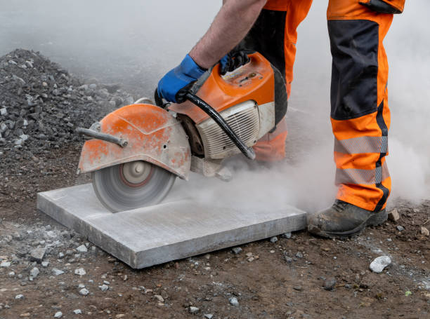 Wet saw used to cut pavers precisely during patio construction project