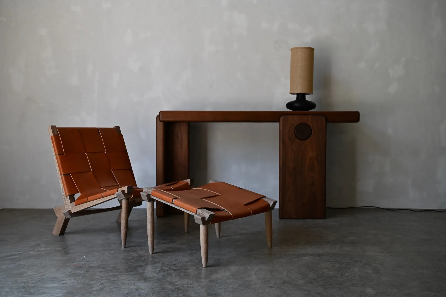 A couple of chairs sitting next to a table.