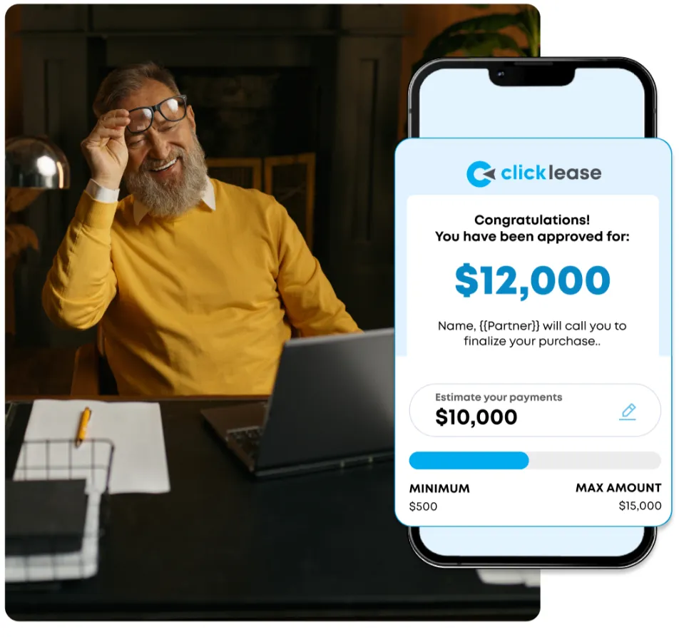 a man sitting in front of a laptop computer