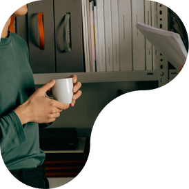 two coworkers talking over coffee