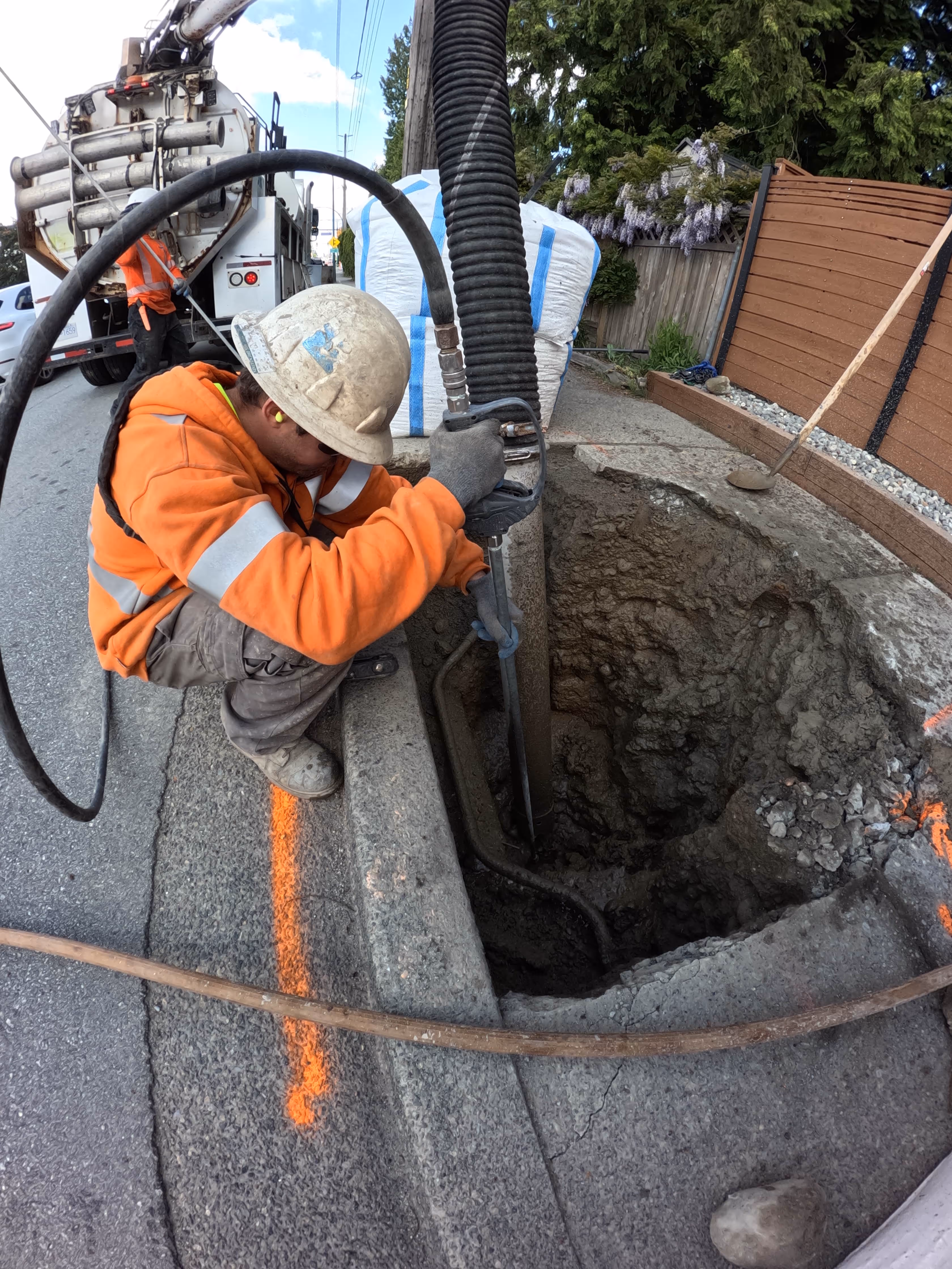 Heavy machinery operation for underground infrastructure project excavation and construction site development work.