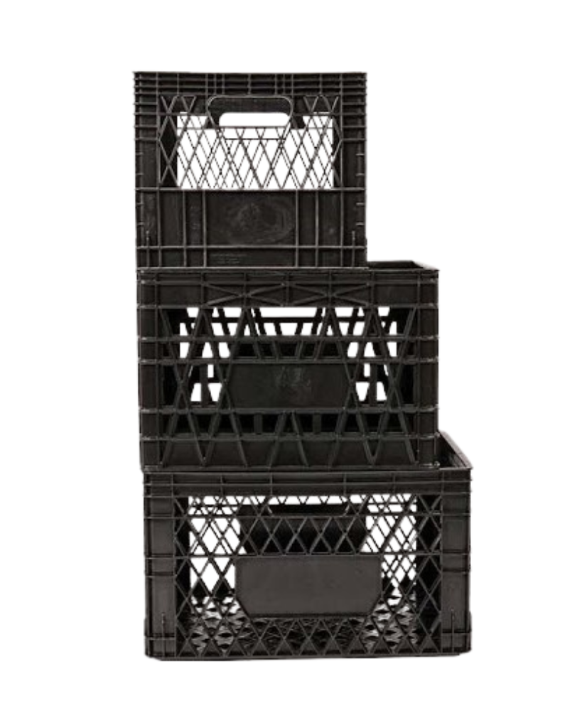 Three black plastic milk crates stacked in a stepped arrangement.