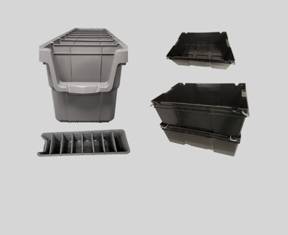 Several black plastic storage bins, including one with compartments and others stacked or arranged on a gray background.