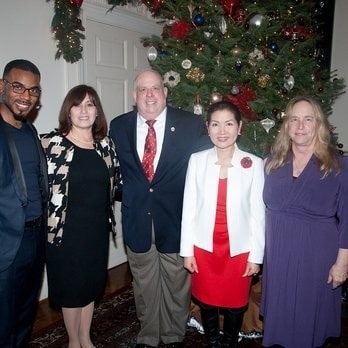 Reliable Language Services business owner with Larry Hogan in 2011, highlighting a milestone in the company's history.