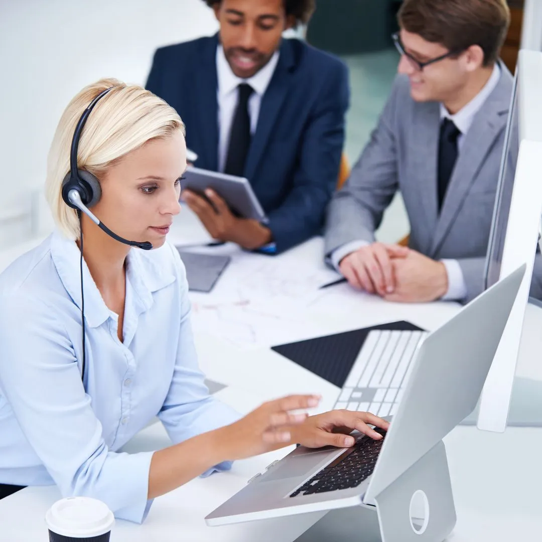 A certified phone interpreter providing real-time language assistance for a business professional.