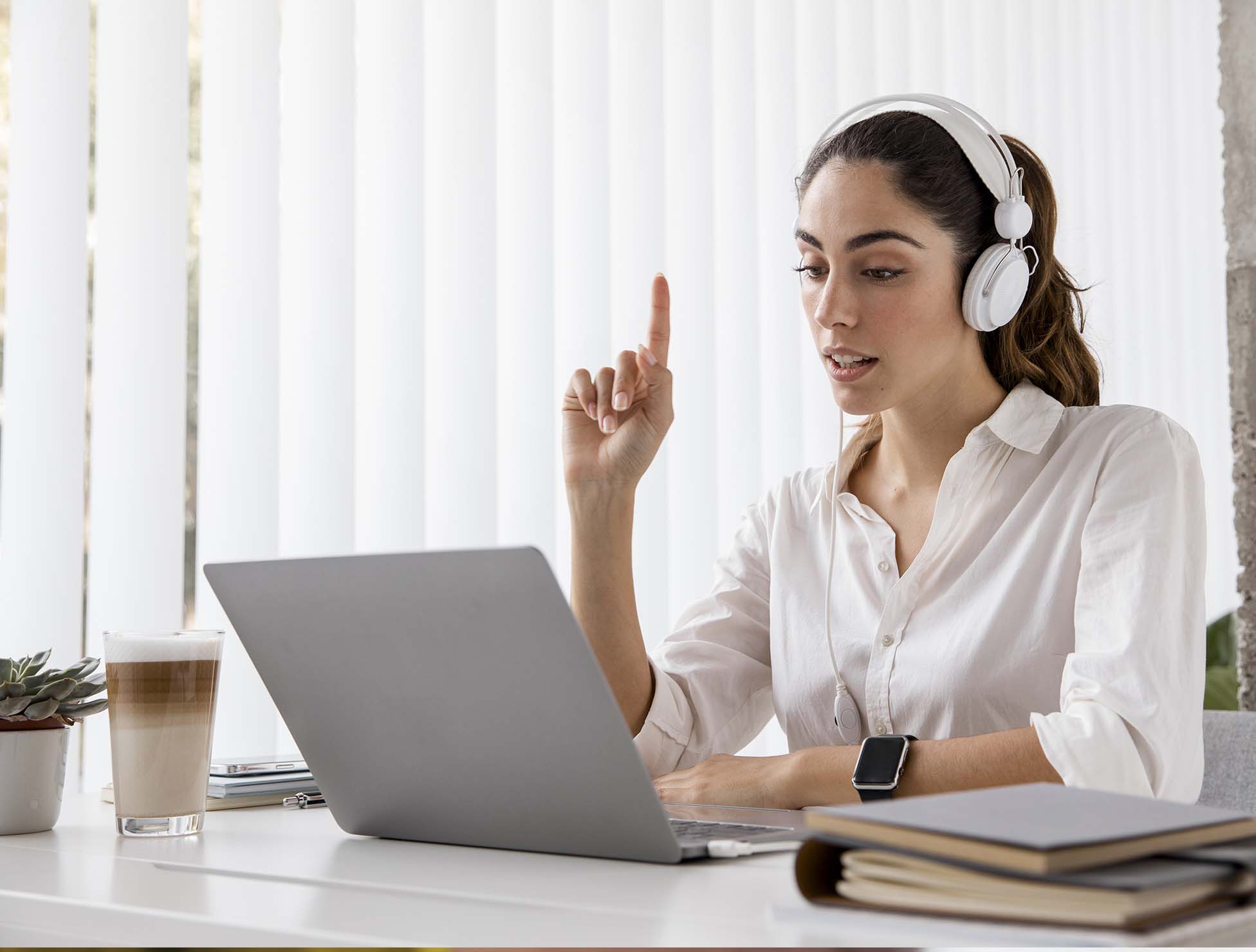 A professional interpreter providing real-time language solutions through a headset, ensuring seamless multilingual communication across various industries.