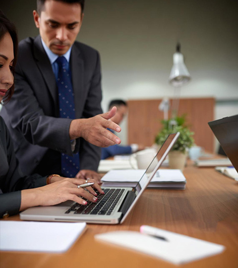 A business professional conducting an international meeting with multilingual communication support for corporate expansion.