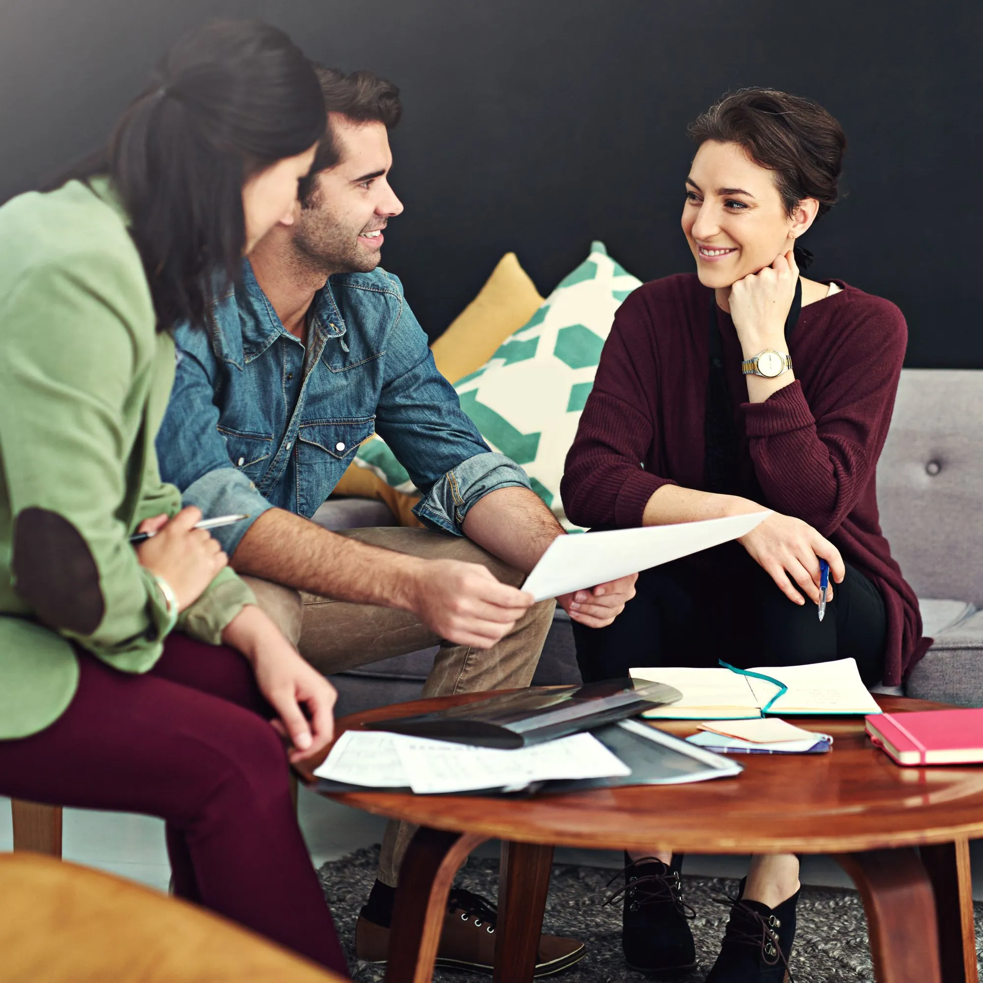 An interpreter assisting a student and teacher in a multilingual classroom, ensuring equal learning opportunities.