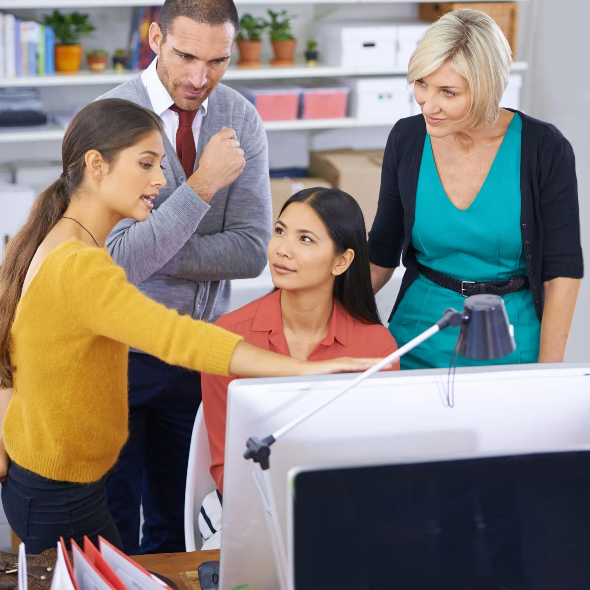 A business team collaborating on global expansion with multilingual communication support and translated documents.