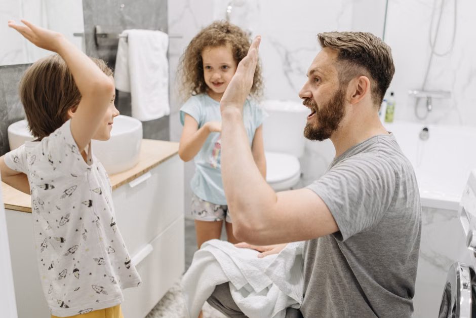 Family using multiple hot water fixtures simultaneously in a modern home