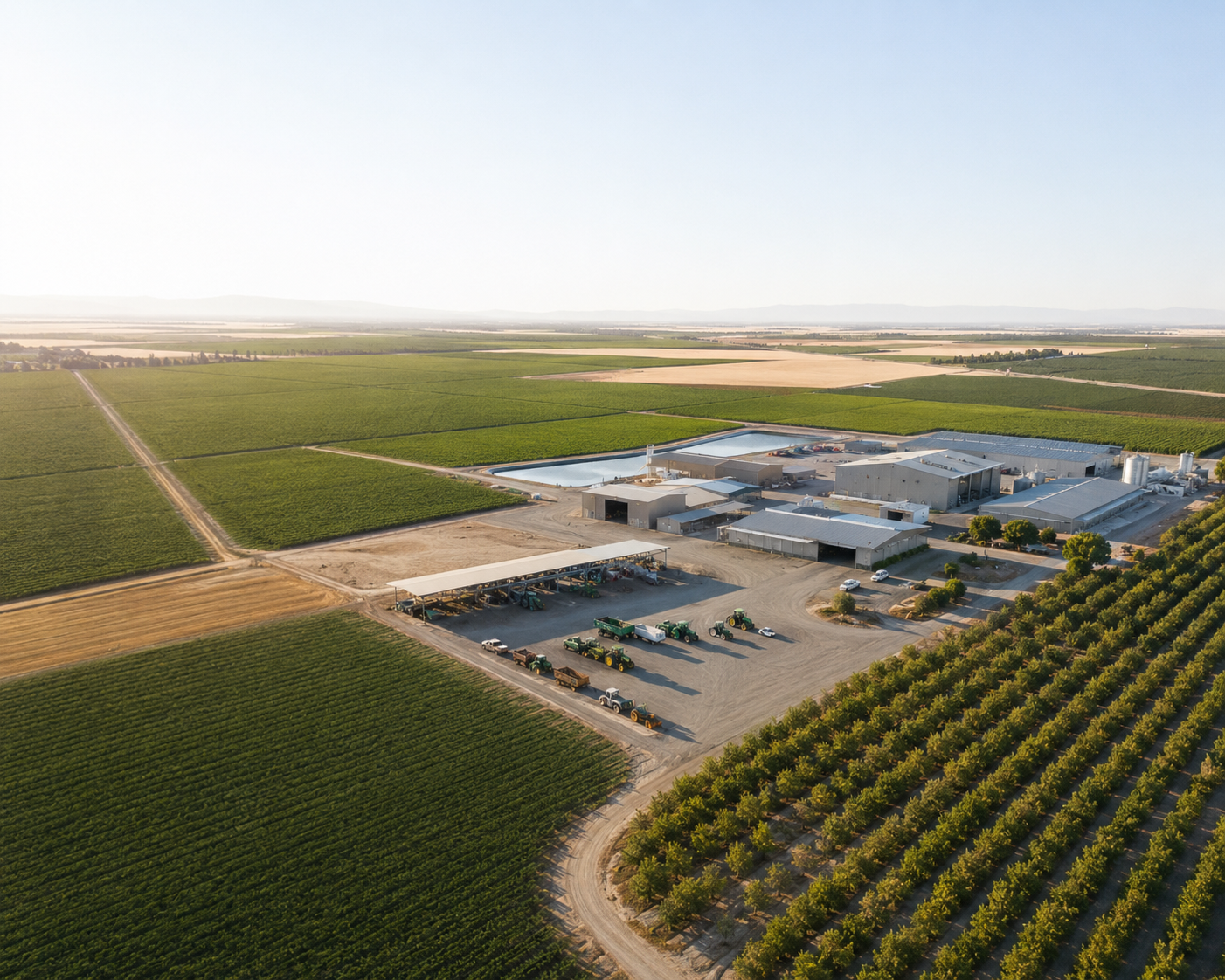 A tractor plows a large, green field with neat rows. Overlaid text reads: Unlocking the Potential of Captive Insurance for Agricultural Businesses.