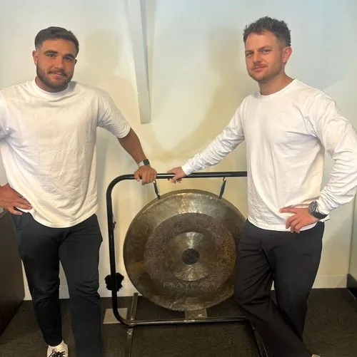 Tom & Ben smashing the gong