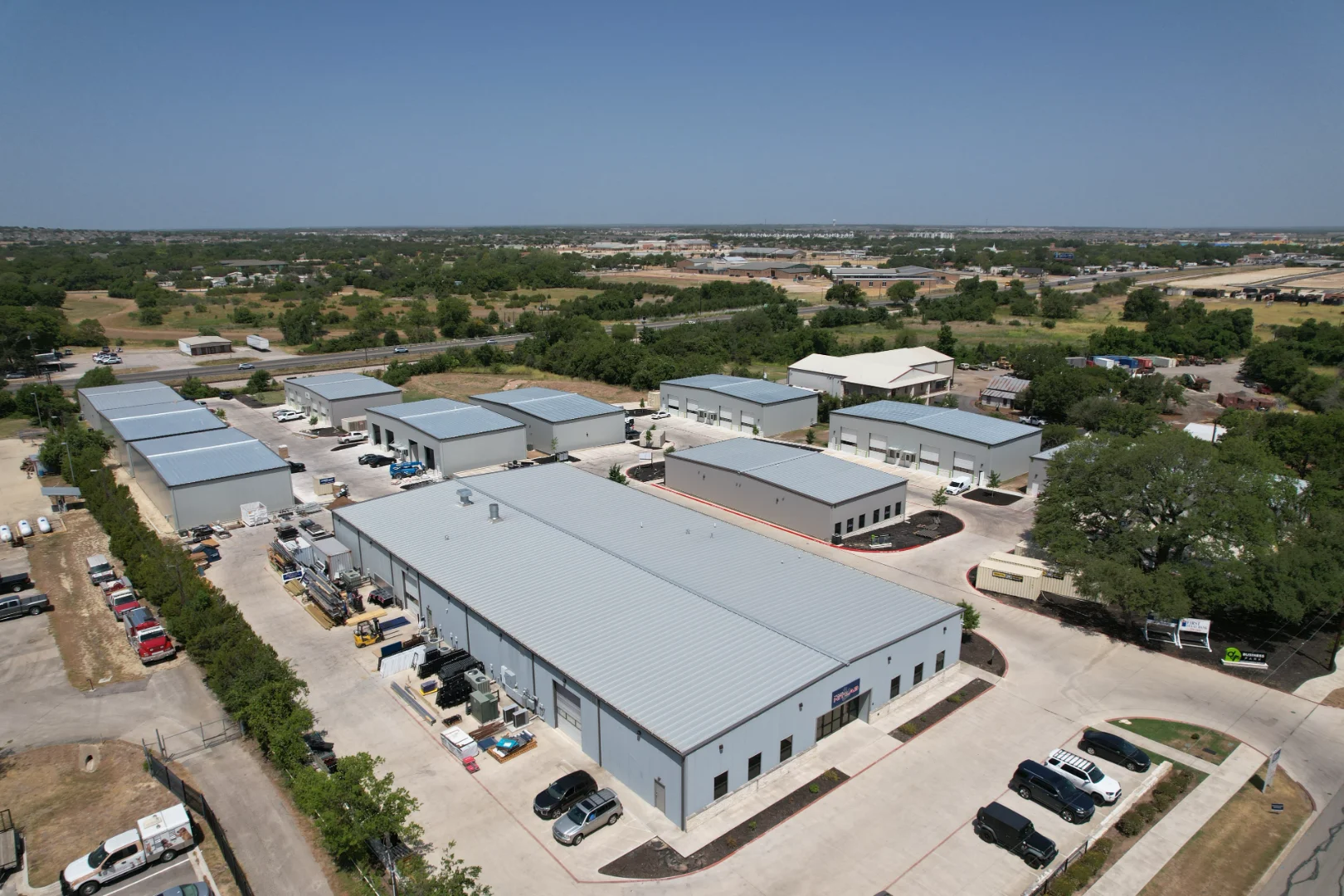 Structural steel building with pre-engineered metal systems