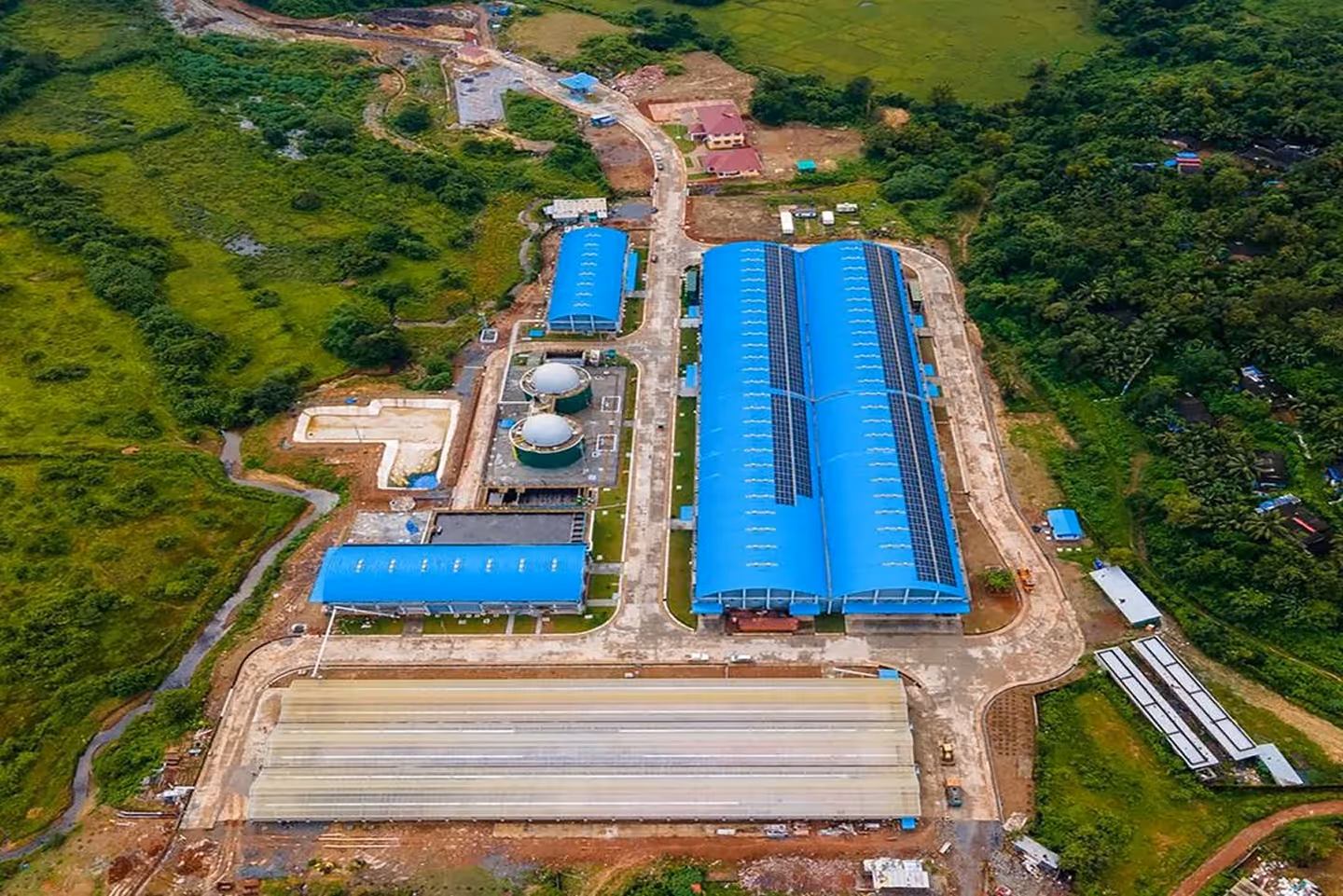 Manufacturing facility producing corrugated steel roofing sheets