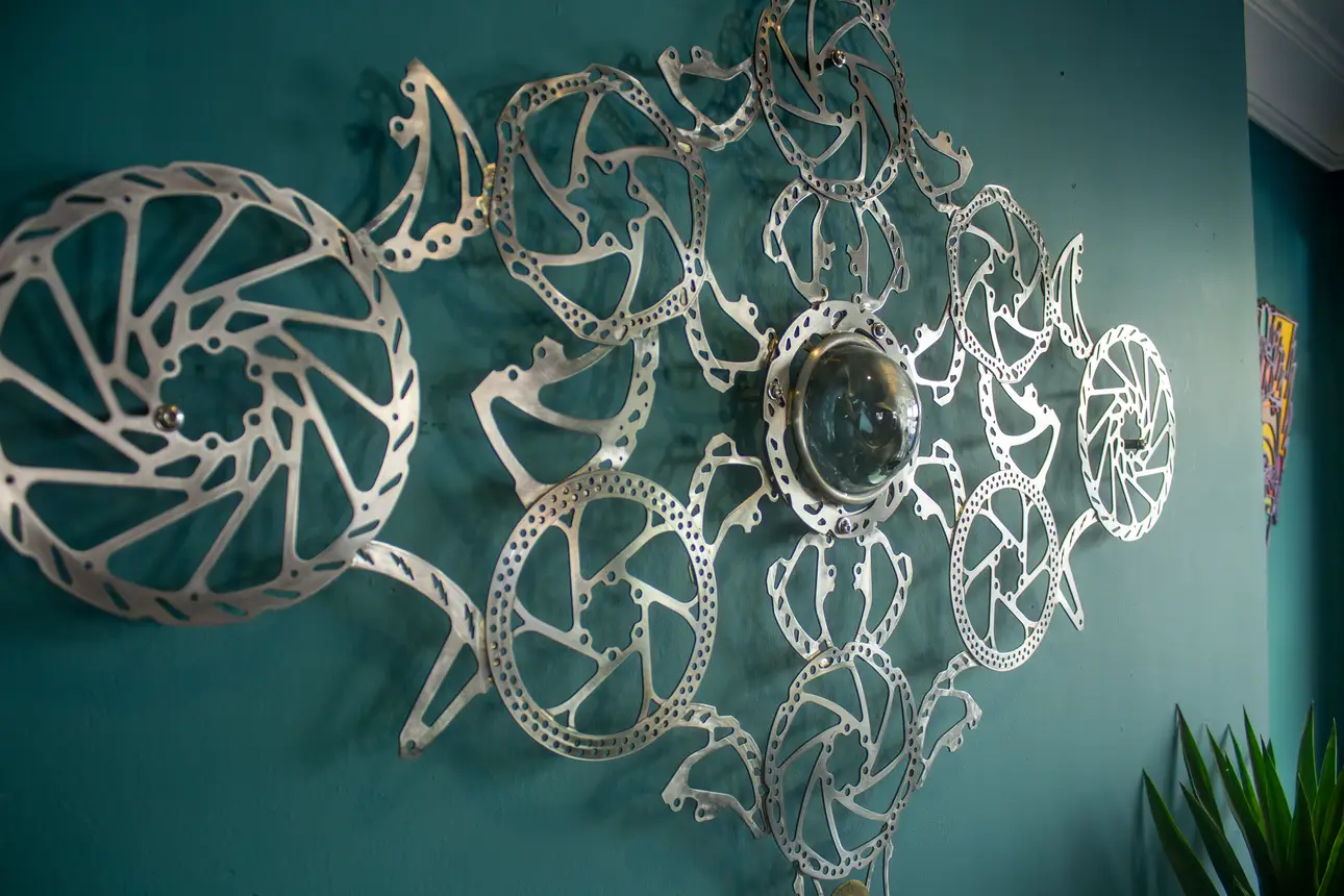 Decorative, funky metal art pieces hung in The Shakespeare, Totterdown, Bristol. Made using recycled bike parts by local artist 