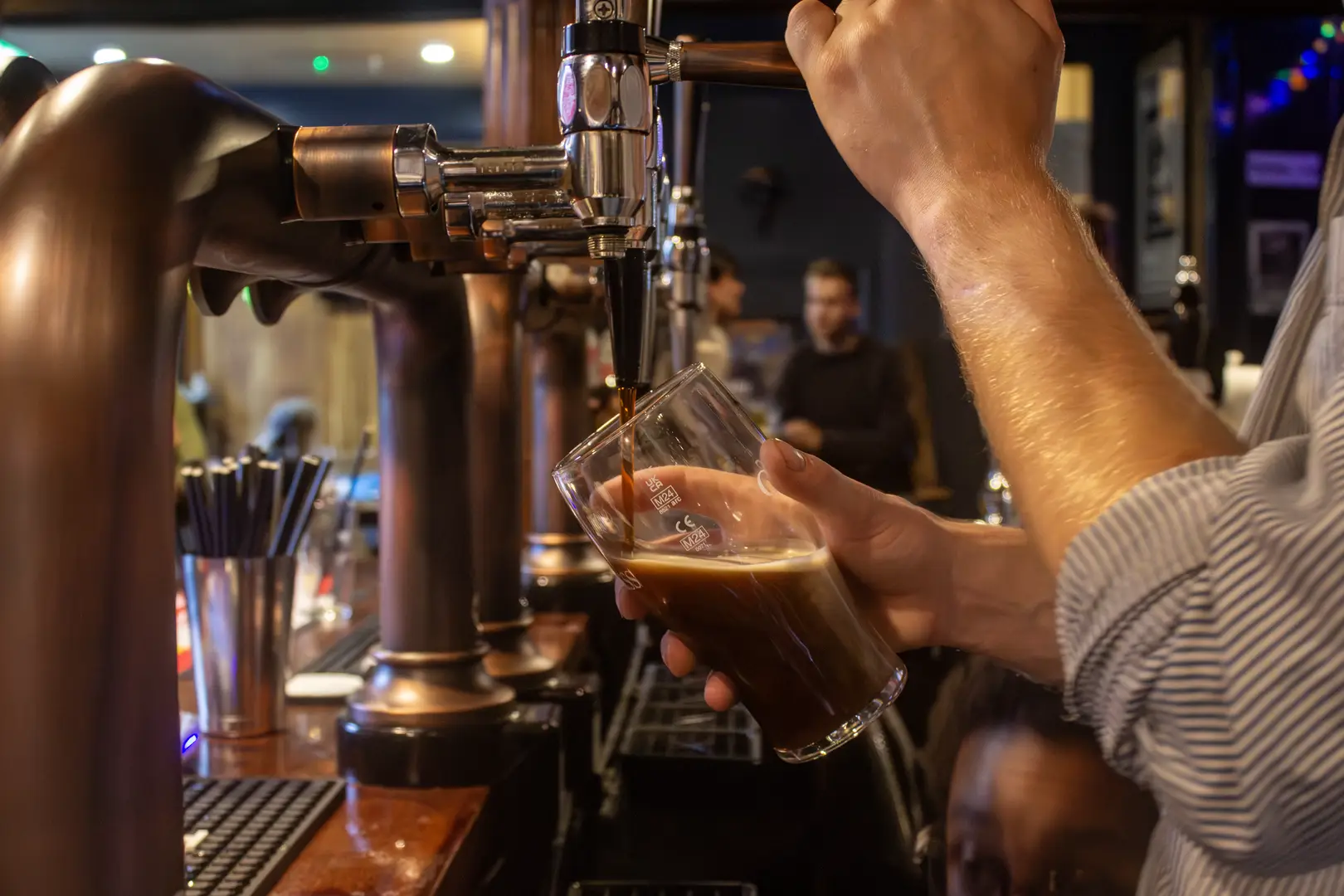 A perfectly poured Guinness, in a historic pub full of charm, history, and a friendly atmosphere