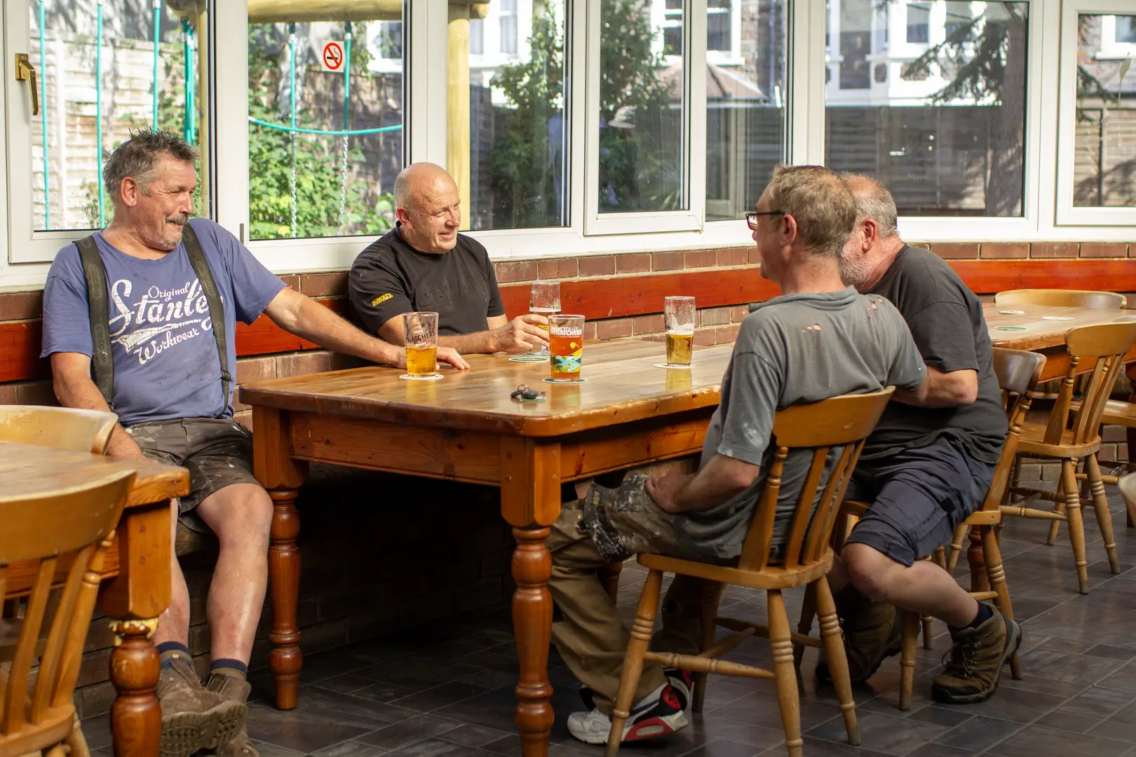 Friends gather, laugh, and relax in the conservatory of The Annexe, a popular sports pub in Bishopston.